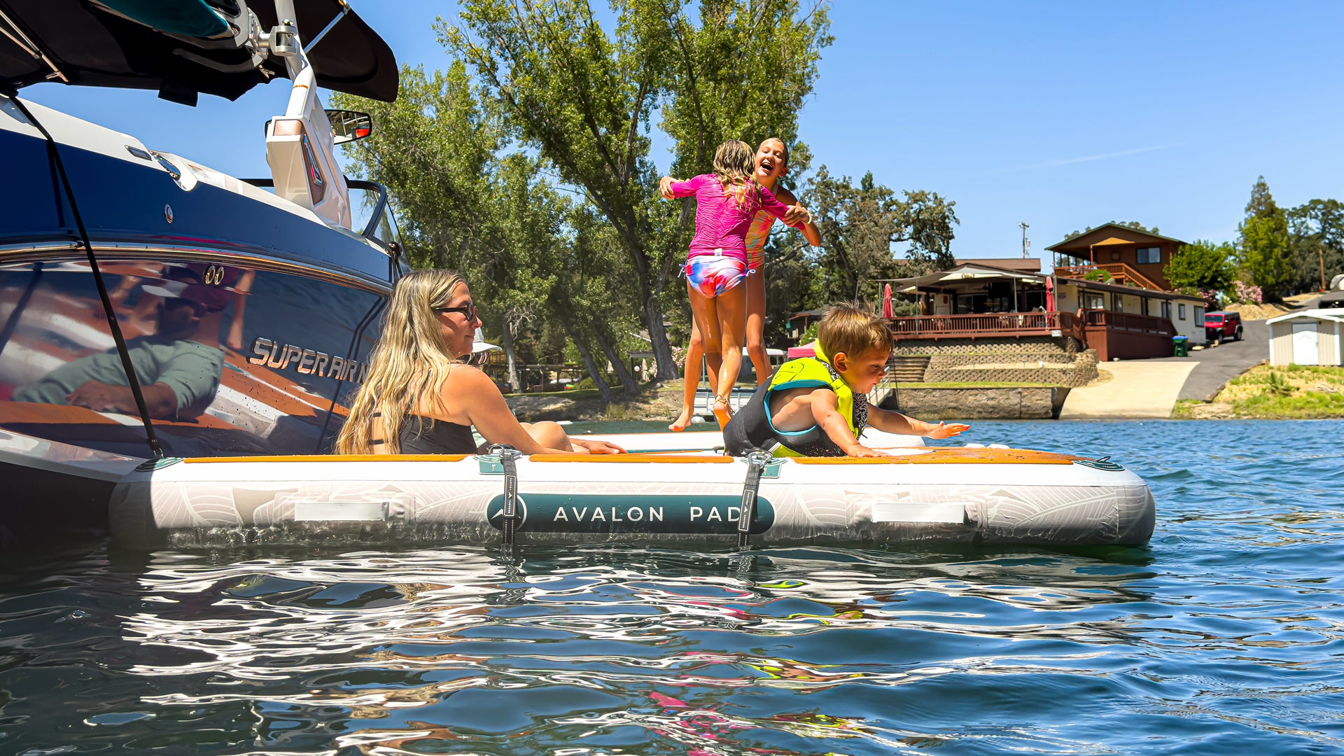 Further Customs 878 Avalon Pad Water Hammock Mesh Lounge AquaDock Platform Kids Playing in the Sun and Parents Chilling