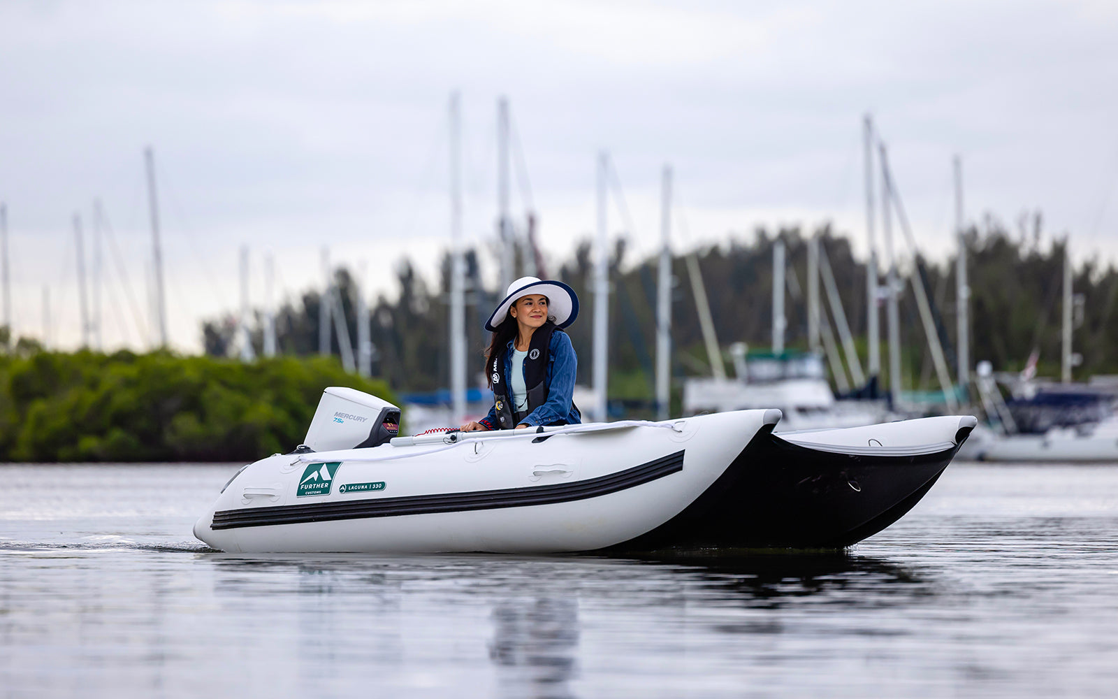 Mercury Avator 7.5e Electric Outboard Engine Propelling Further Customs Laguna330 Inflatable Catamaran