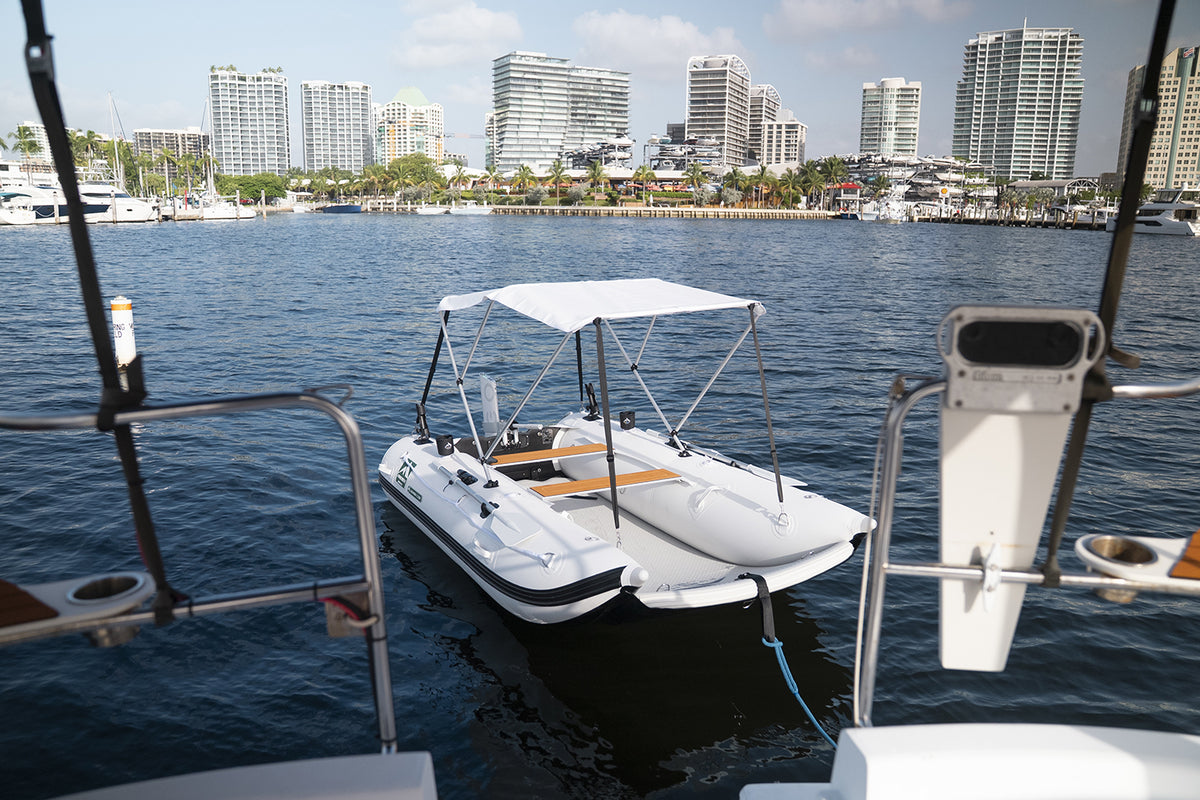 Best Electric outboard Engine for Sailboats and Tenders Remigo One on a Laguna Catamaran in Miami Bay